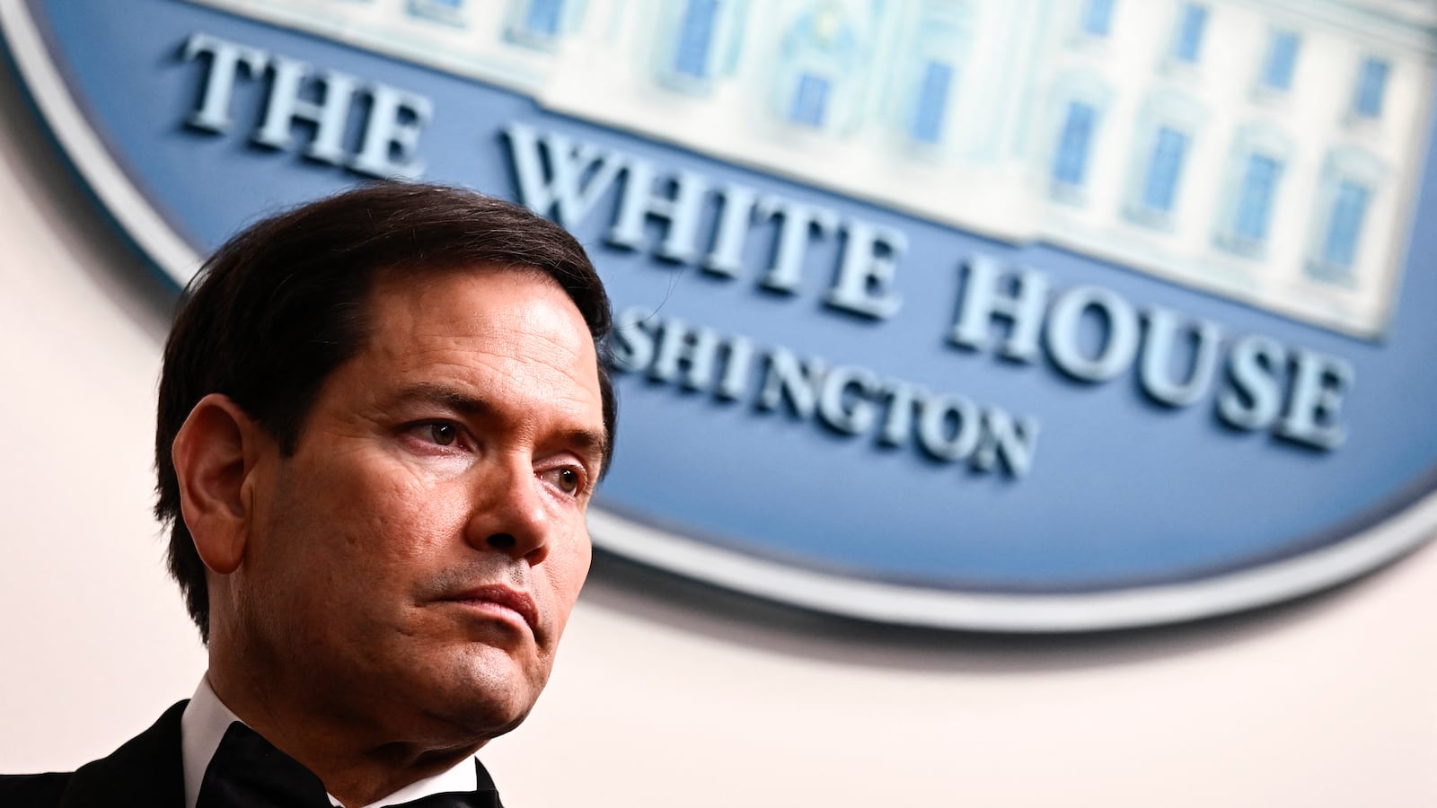US Secretary of State Marco Rubio listens to US President Donald Trump speak during a press briefing in the Brady Briefing Room at the White House in Washington, DC, shortly after a shooting incident at the White House Correspondents' Dinner on April 25, 2026.