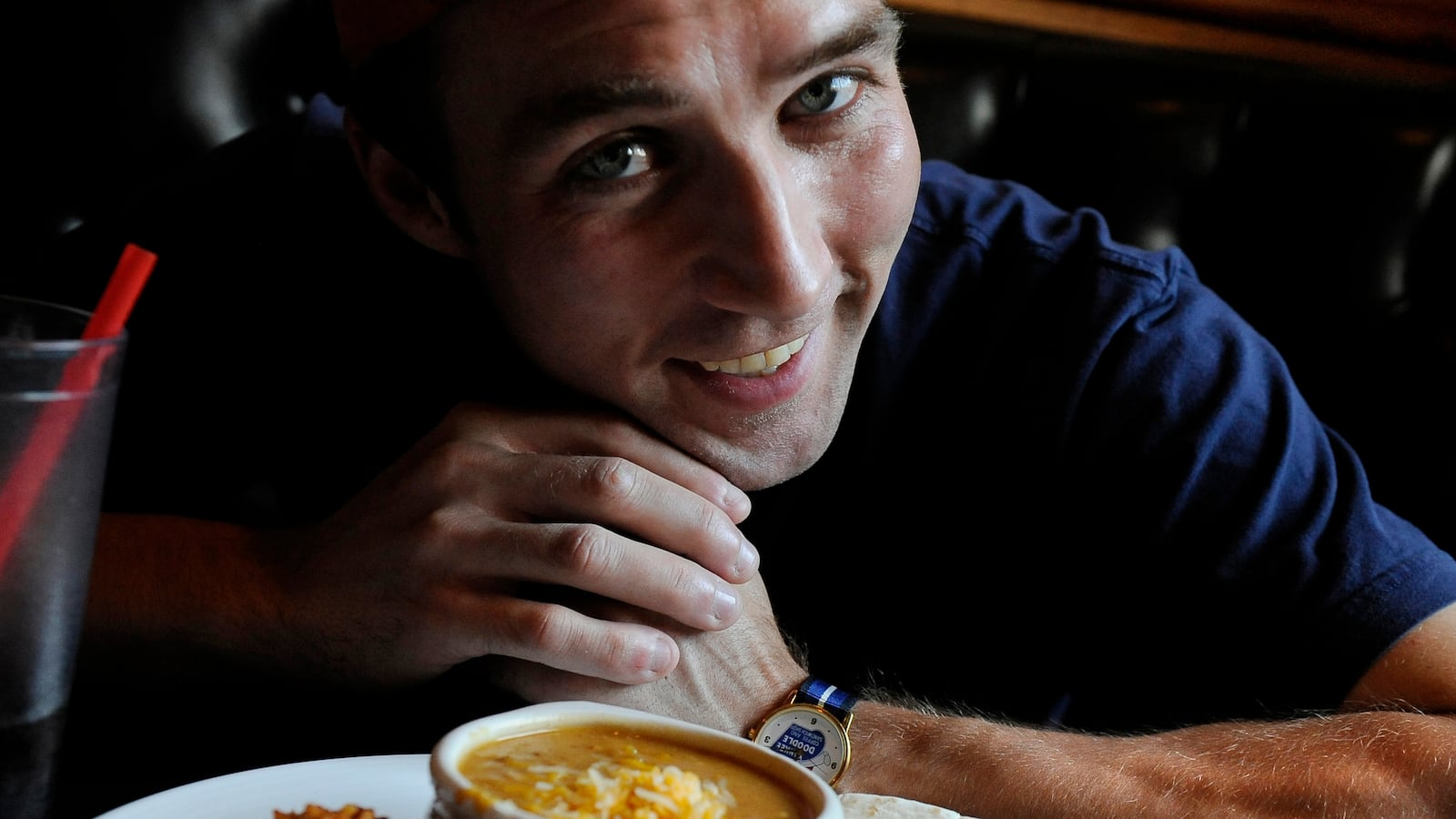 Tim "Eater X" Janus poses for a portrait with his lunch, the Green Chili Plate, at City Grille in Denver, CO, August 27, 2010. Janus was talking with the Denver Post about the eating contest he will participate in on Saturday, hosted by the Isle of Capri Casinos Hotel and Lady Luck Casino in Black Hawk, CO. Janus currently hold 7 world records in various eating contests.