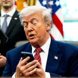 WASHINGTON, DC  May 23, 2025:

US President Donald Trump silenced his cellphone in the Oval Office of the White House on Friday May 23, 2025. The executive orders were related to the nuclear power industry in the US.

(Photo by Demetrius Freeman/The Washington Post via Getty Images)