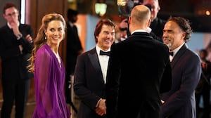 Prince William and Princess Catherine speak with director Alejandro G. Inarritu and Tom Cruise as they attend the "Digger" world premiere in London.