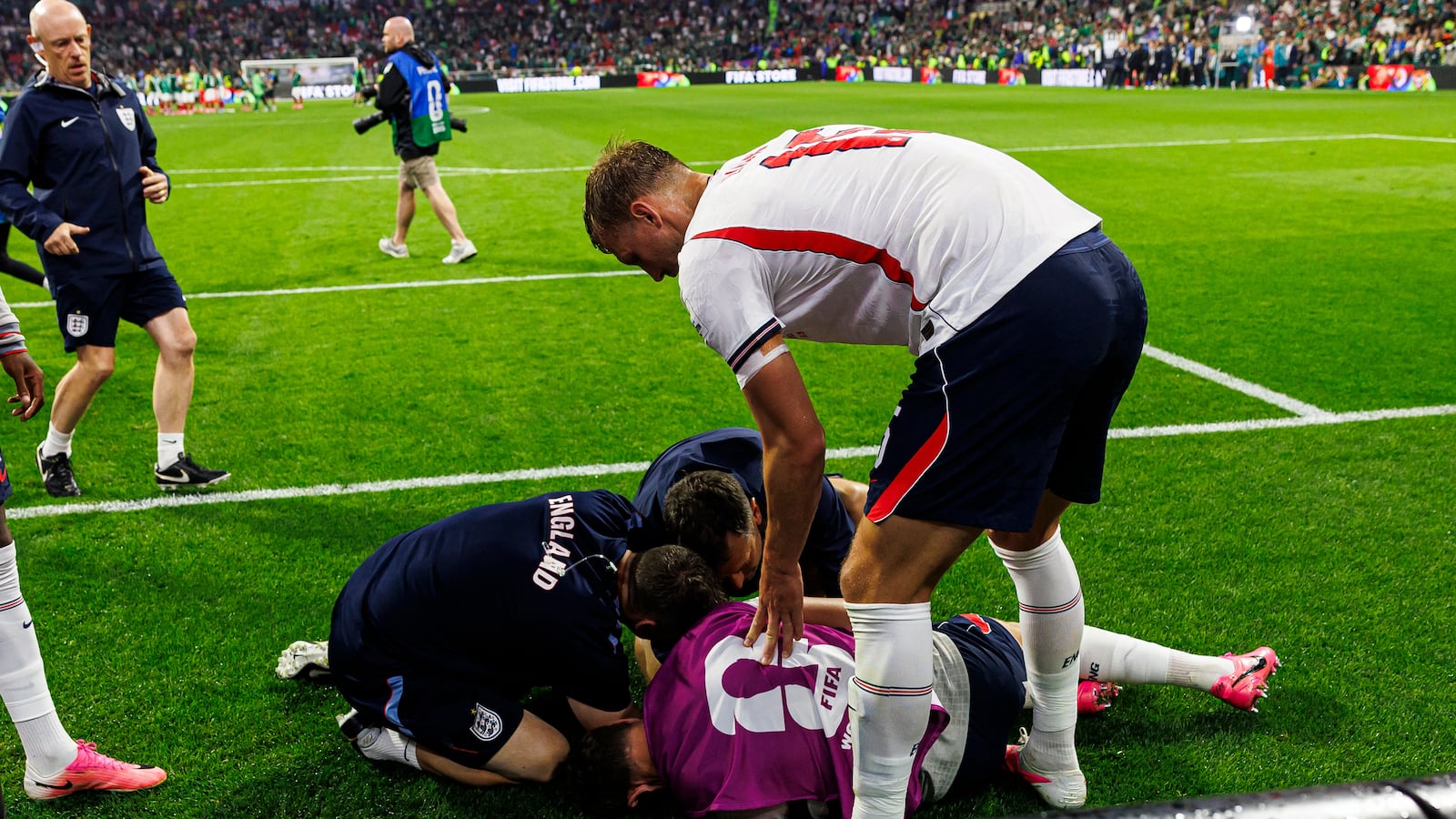 Dan Burn of England (R) tries to help his teammate Jordan Henderson who was injured amid the celebrations after winning the FIFA World Cup 2026 Round Of 16 match between Mexico and England at Mexico City Stadium on July 5, 2026 in Mexico City, Mexico.