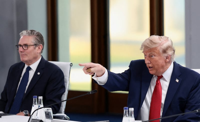 U.S. President Donald Trump, French President Emmanuel Macron and British Prime Minister Keir Starmer attend a working session with G7 leaders and outreach partners on promoting economic growth during the G7 Summit in Evian-les-Bains, France, June 17, 2026. REUTERS/Evelyn Hockstein