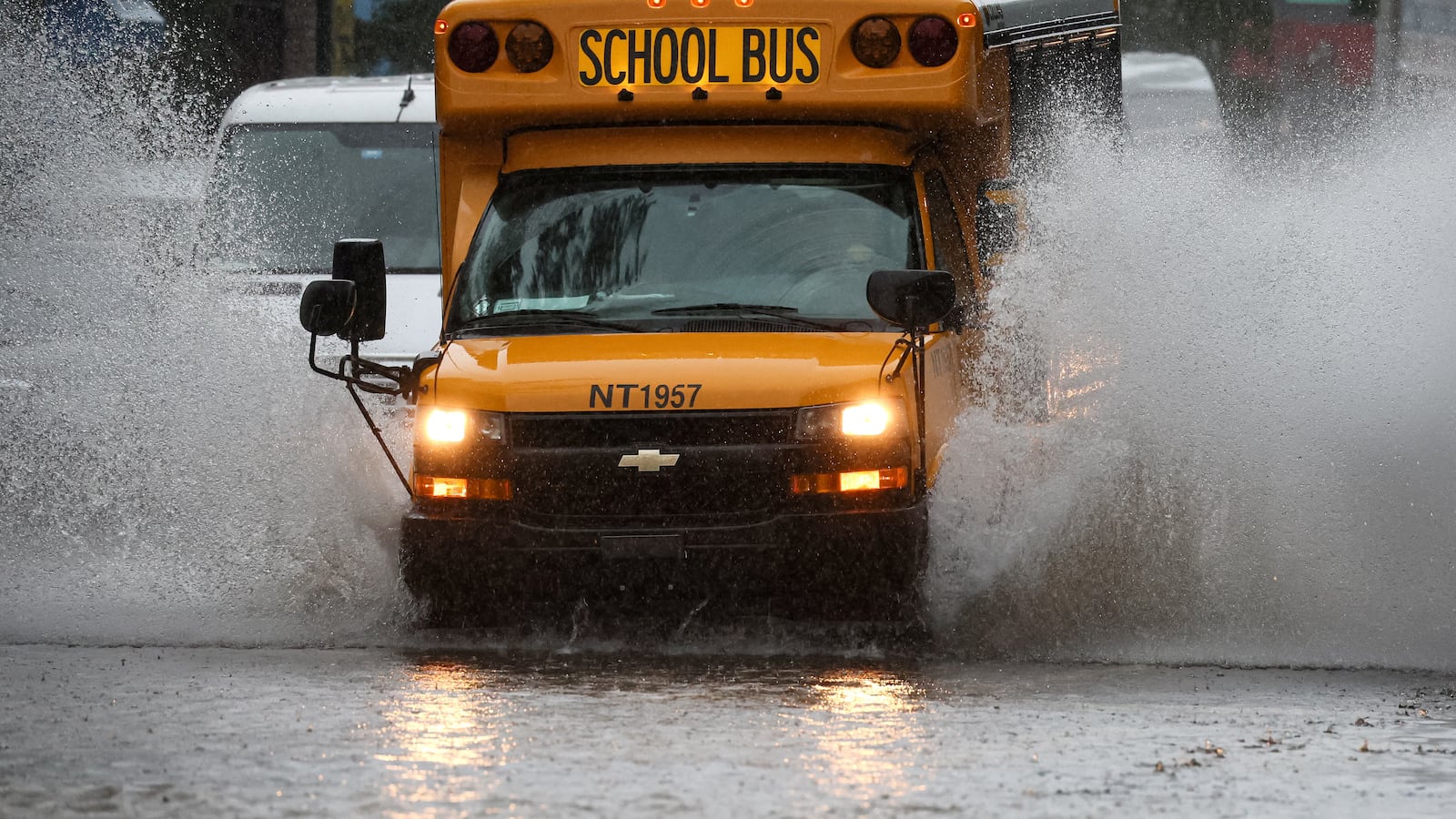 A school bus drives on a flooded street, as the remnants of Tropical Storm Ophelia bring flooding across mid-Atlantic and Northeast, in the Brooklyn borough of New York City.