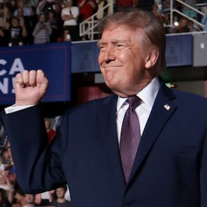 US President Donald Trump raises his fist as he attends a rally, ahead of the midterm elections, at The Mitchell Center at the University of South Alabama in Mobile, Alabama, US, October 2, 2026. REUTERS/Jessica Koscielniak