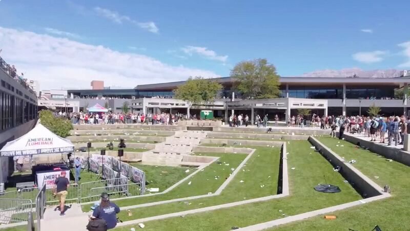 People look at the scene where U.S. right-wing activist and commentator Charlie Kirk was shot during a Utah Valley University event, in Orem, Utah, Sept. 10, 2025, in this screen grab from social media video.