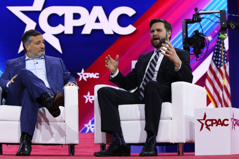 JD Vance speaks as Sen. Ted Cruz(L) listens during the annual Conservative Political Action Conference (CPAC) at Gaylord National Resort & Convention Center on March 2, 2023 in National Harbor, Maryland.