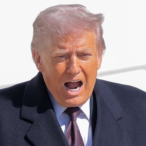 U.S. President Donald Trump departs the White House alongside White House Press Secretary Karoline Leavitt (L) and boards Marine One on the South Lawn on February 27, 2026 in Washington, DC.