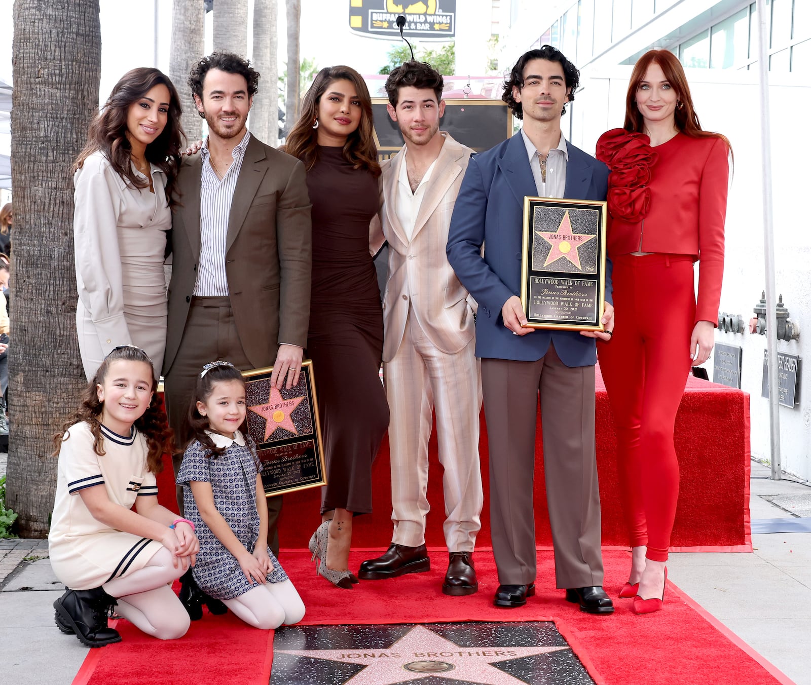 HOLLYWOOD, CALIFORNIA - JANUARY 30: (L-R) Danielle Jonas, Kevin Jonas, Priyanka Chopra, Nick Jonas, Joe Jonas, Sophie Turner, and (front) Alena Rose Jonas and Valentina Angelina Jonas attend The Hollywood Walk of Fame star ceremony honoring The Jonas Brothers on January 30, 2023 in Hollywood, California. (Photo by Amy Sussman/Getty Images)