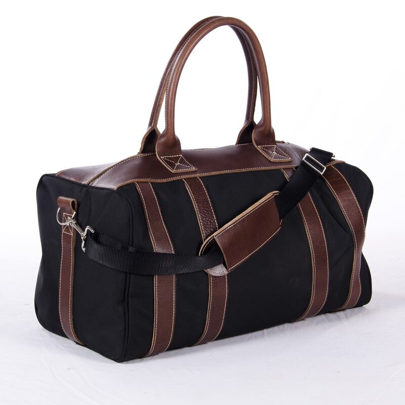 galleries/2012/11/22/from-earrings-to-sneakers-to-beats-by-dre-the-best-black-items-to-buy-on-black-friday/black-friday-shopping-blue-claw-bag_k8t3gi