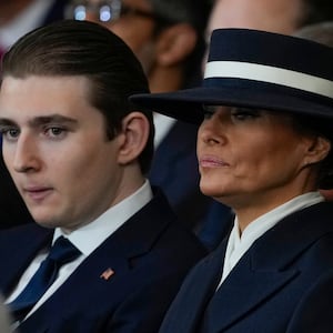 WASHINGTON, DC - JANUARY 20:  Barron Trump and first lady Melania Trump listen as President Donald Trump gives his inaugural address in the U.S. Capitol Rotunda on January 20, 2025 in Washington, DC. Donald Trump takes office for his second term as the 47th president of the United States. (Photo by Julia Demaree Nikhinson - Pool/Getty Images)