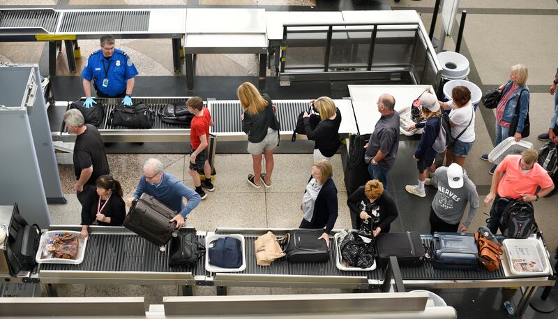 DENVER, COLORADO - JUNE 20, 2019: Airplane passengers line up for TSA security screenings at Denver International Airport in Denver, Colorado. (Photo by Robert Alexander/Getty Images)