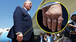 A photo illo of Donald Trump's hand as he speaks to reporters after departing Air Force One on May 20, 2026 at Joint Base Andrews, Maryland.