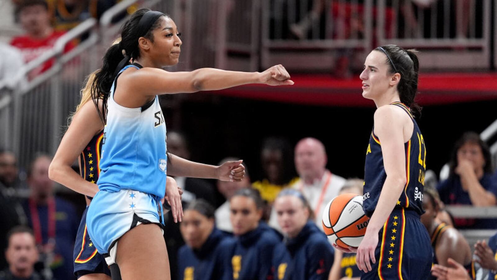 Angel Reese of the Chicago Sky reacts after fouling Caitlin Clark of the Indiana Fever.