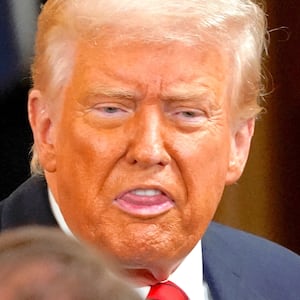 U.S. President Donald Trump gestures during an event to sign an executive order to shut down the Department of Education, in the East Room at the White House in Washington, D.C., U.S., March 20, 2025.