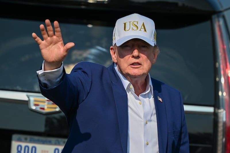 President Donald Trump waves goodbye after the final round of the LIV Golf New York tournament at Trump National Bedminster.