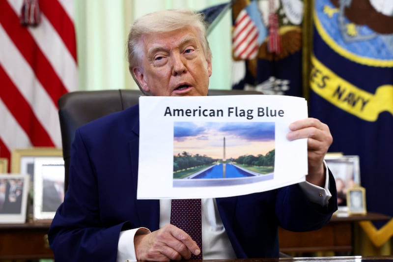 U.S. President Donald Trump holds a reflecting pool image at the Oval Office of the White House, in Washington, D.C., June 3, 2026.