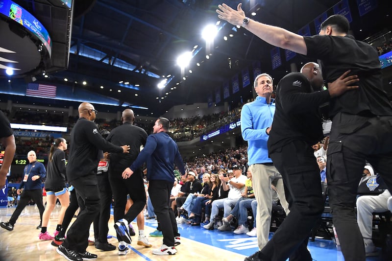 Turkish-American former basketball player and human rights activist Enes Kanter Freedom reacts as he is removed from the arena during the second half against the Indiana Fever at Wintrust Arena.