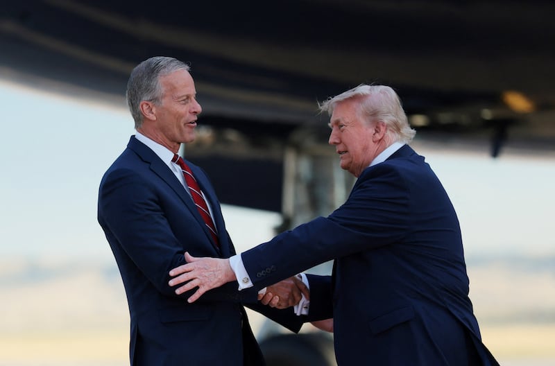 U.S. President Donald Trump meets Senate Majority Leader John Thune (R-SD) upon arrival at Ellsworth Air Force Base in Belle Fourche-Cheyenne Valleys, South Dakota, U.S., July 3, 2026. REUTERS/Kylie Cooper