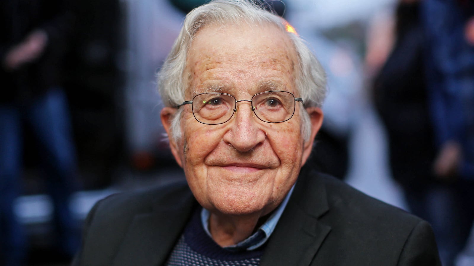 Noam Chomsky has been hospitalized in Brazil as he recovers from a massive stroke, his wife told the Associated Press.