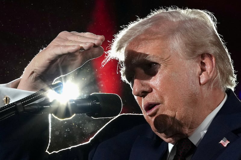 U.S. President Donald Trump shields his eyes from light as he speaks during the National Republican Congressional Committee (NRCC) annual fundraising dinner in Washington, D.C., U.S., March 25, 2026.