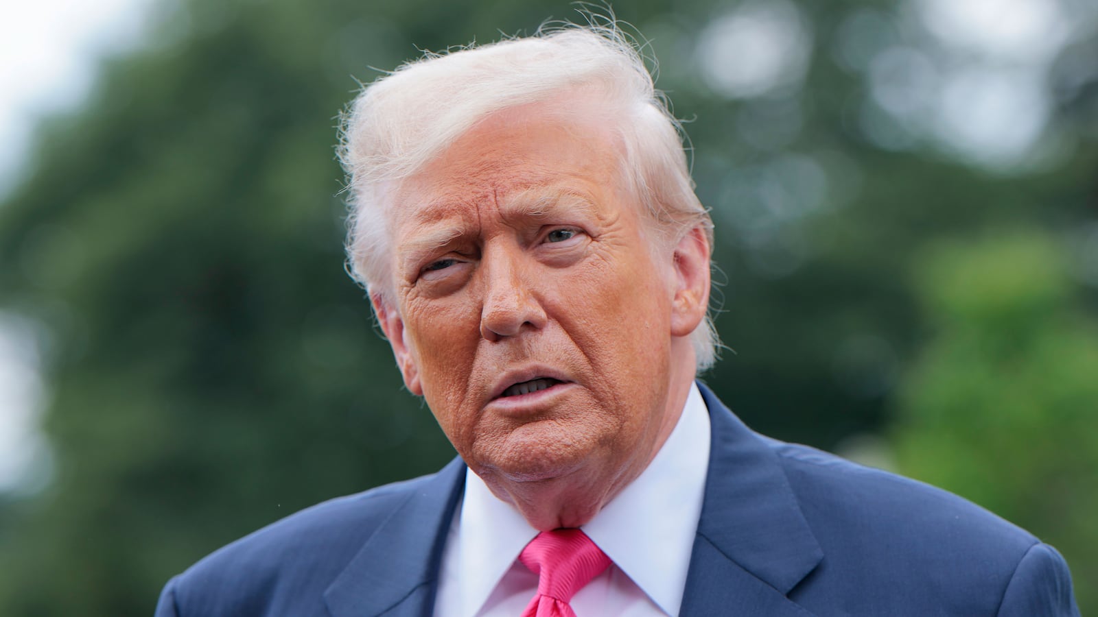 President Donald Trump speaks to the media as he departs the White House on July 15, 2025 in Washington, DC.