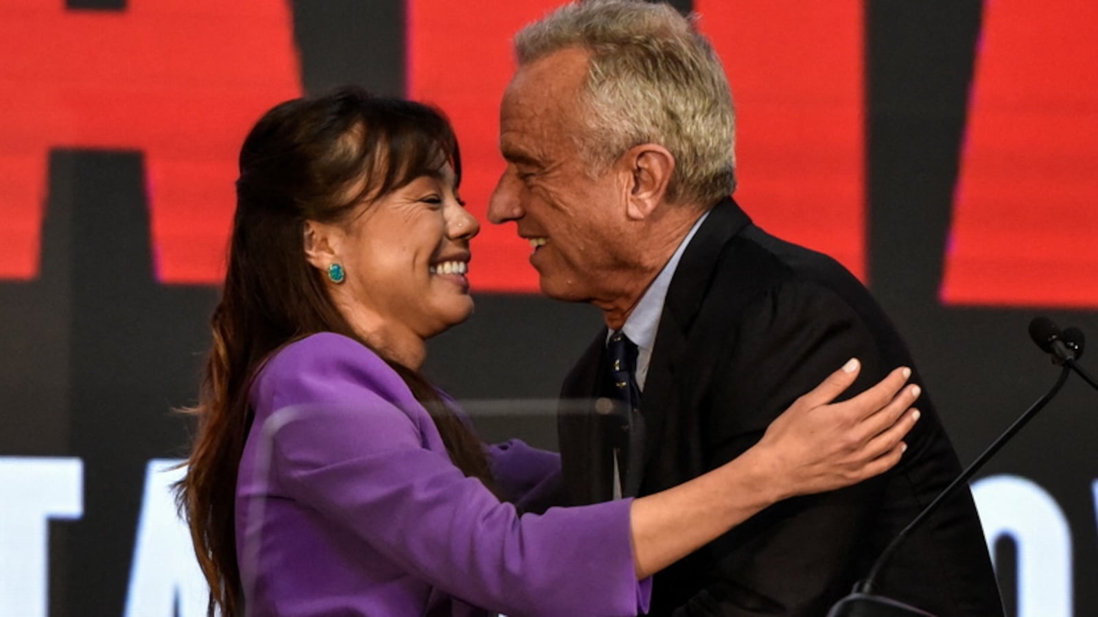Independent presidential candidate Robert F. Kennedy, Jr. hugs Nicole Shanahan as she becomes the vice presidential candidate of Kennedy, in Oakland, California.