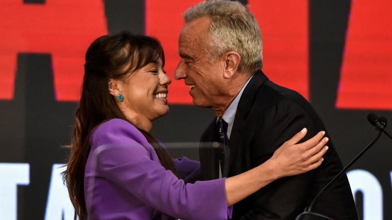 Independent presidential candidate Robert F. Kennedy, Jr. hugs Nicole Shanahan as she becomes the vice presidential candidate of Kennedy, in Oakland, California.