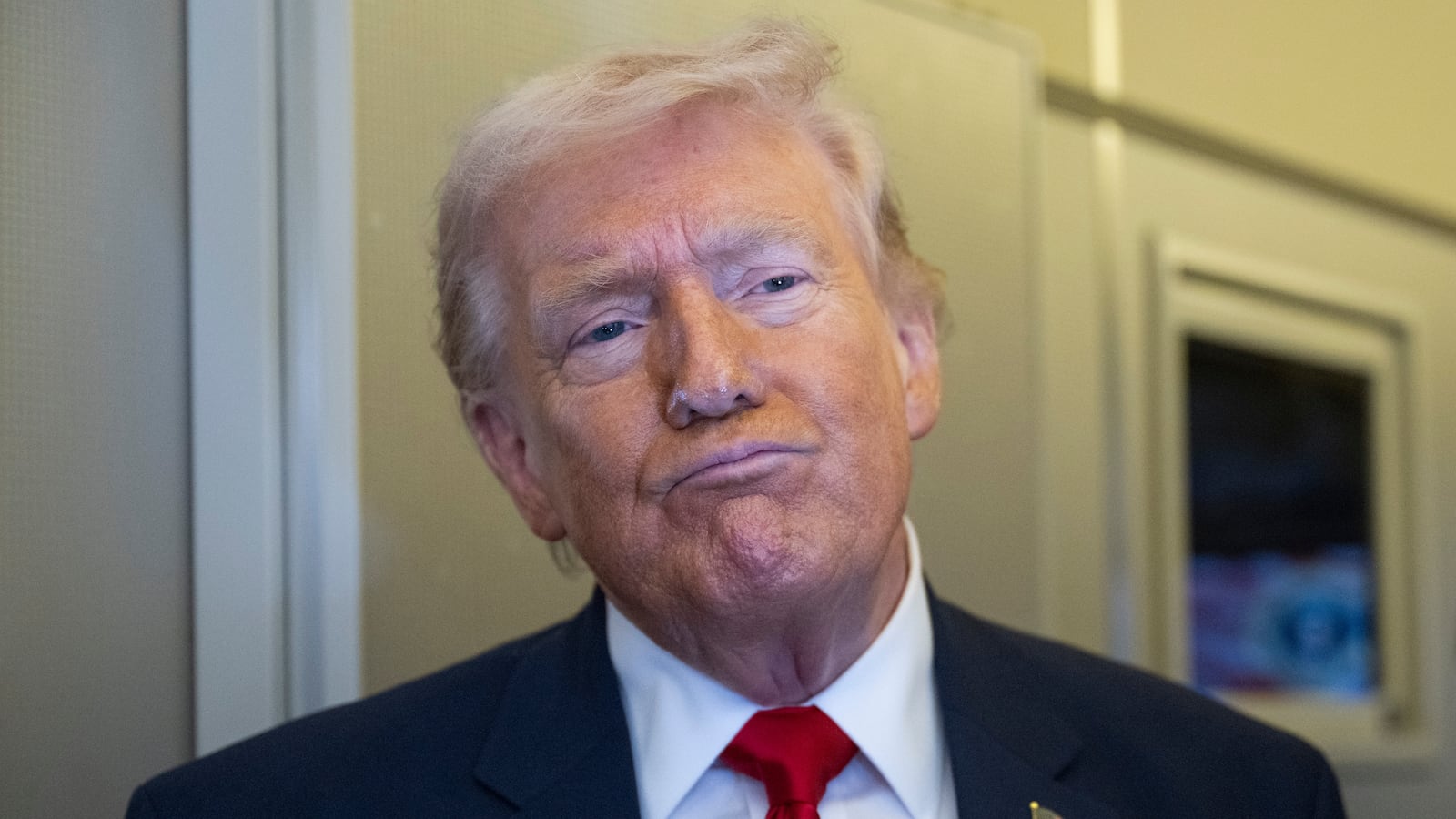 IN FLIGHT- MARCH 7:U.S. President Donald Trump speaks to members of the media traveling on Air Force One while heading to Miami on March 7, 2026. President Trump and other members of the government attended the dignified transfer of six soldiers from the 103rd Sustainment Command who were killed in action by an Iranian drone strike on March 1 in Port of Shuaiba, Kuwait during "Operation Epic Fury". (Photo by Roberto Schmidt/Getty Images)