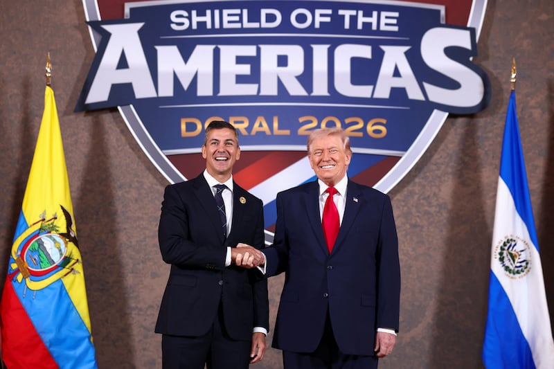 U.S. President Donald Trump shakes hands with Paraguay's President Santiago Pena as they attend the "Shield of the Americas" Summit in Miami, Florida, U.S., March 7, 2026. REUTERS/Kevin Lamarque