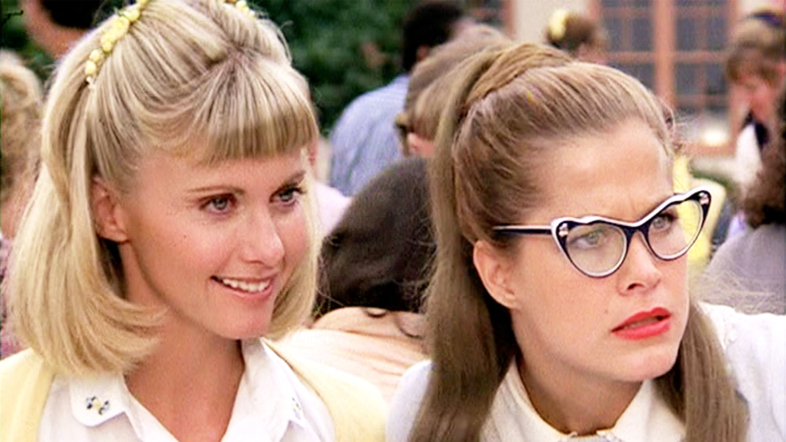 Olivia Newton-John as Sandy Olsen and Susan Buckner as Patty Simcox