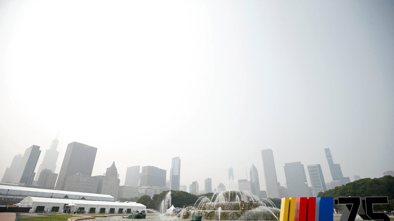 Smokes from the Canadian wildfires lingers over the Chicago skyline, with air quality alerts in 20 states.