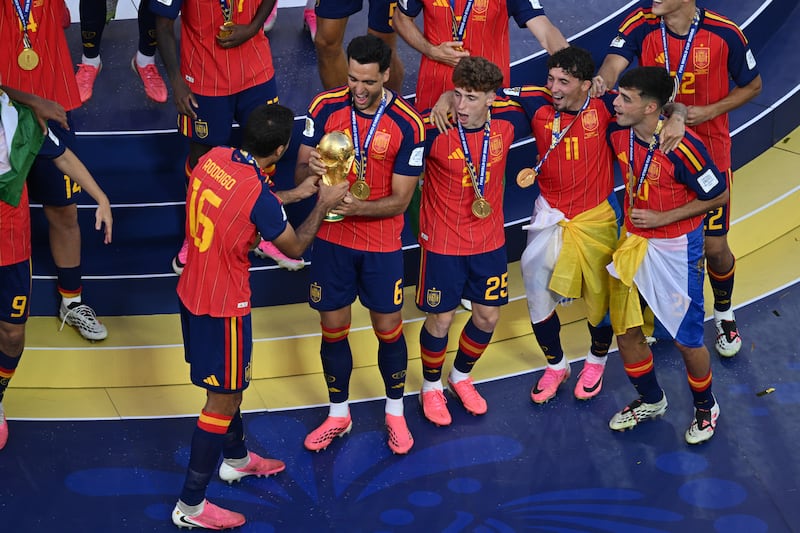 EAST RUTHERFORD, NEW JERSEY - JULY 19: Mikel Merino of Spain and his team mates celebrate with the FIFA World Cup Trophy after the FIFA World Cup 2026 Final match between Spain and Argentina at New York New Jersey Stadium on July 19, 2026 in East Rutherford, United States. (Photo by Sebastian Frej/Getty Images)