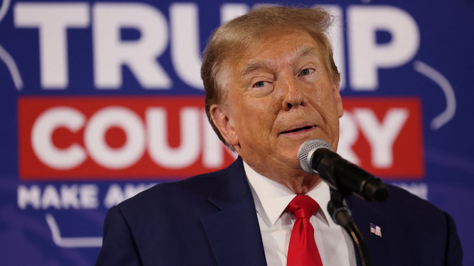 Donald Trump rallies with supporters at a “commit to caucus” event at a Whiskey bar in Ankeny, Iowa, Dec. 2, 2023.