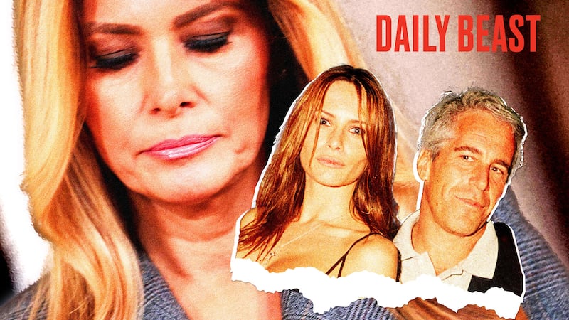 Melania Trump looking down at a photo of her and Jeffrey Epstein