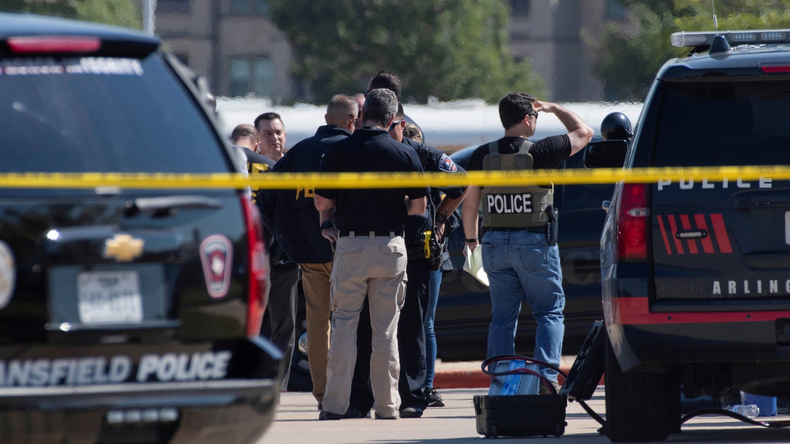 Law enforcement officers secure the school grounds after a shooting at Mansfield Timberview High School in Arlington, Texas, Oct. 6, 2021.