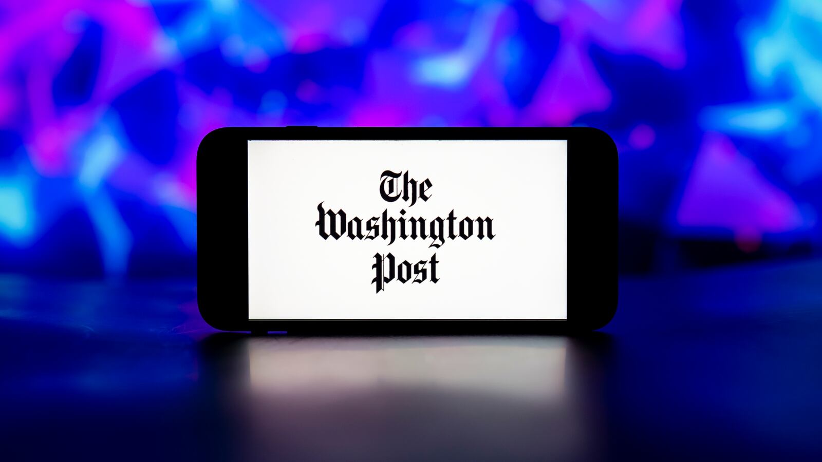 The Washington Post logo on a phone.