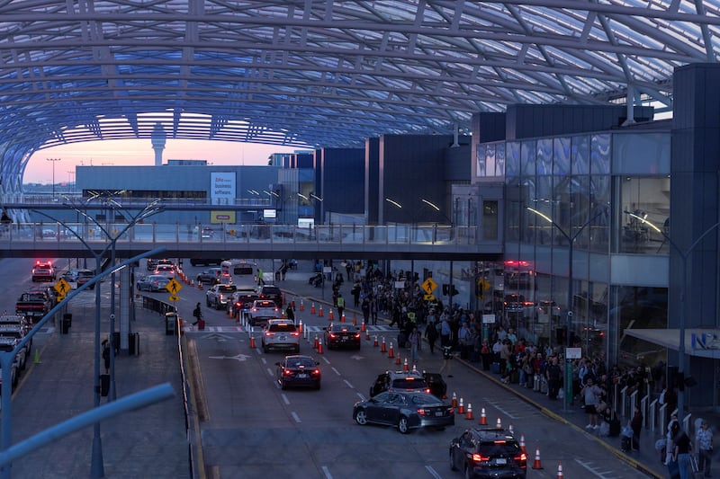 Security lines at Hartsfield-Jackson Atlanta International Airport have become so long that they are spilling outside into a pickup area.