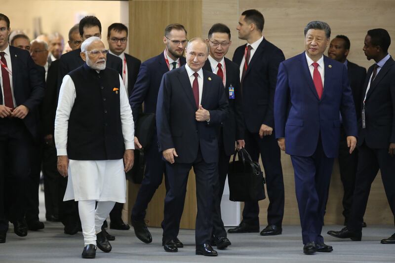 KAZAN, RUSSIA - OCTOBER 23: (RUSSIA OUT) L-R: Indian President Narendra Modi, Russian President Vladimir Putin and Chinese President Xi Jinping attend the BRICS Leader's Summit, on October 23, 2024 in Kazan, Tatarstan Republic, Russia. Putin and representatives of 30 countries are gathering in Kazan for the 16th BRICS Summit today. (Photo by Contributor/Getty Images)