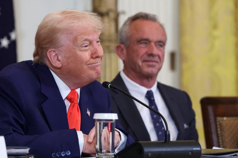 U.S. President Donald Trump and Health and Human Services (HHS) Secretary Robert F. Kennedy Jr. attend a Make America Healthy Again (MAHA) Commission event, in the East Room of the White House in Washington, D.C., U.S., May 22, 2025. REUTERS/Evelyn Hockstein