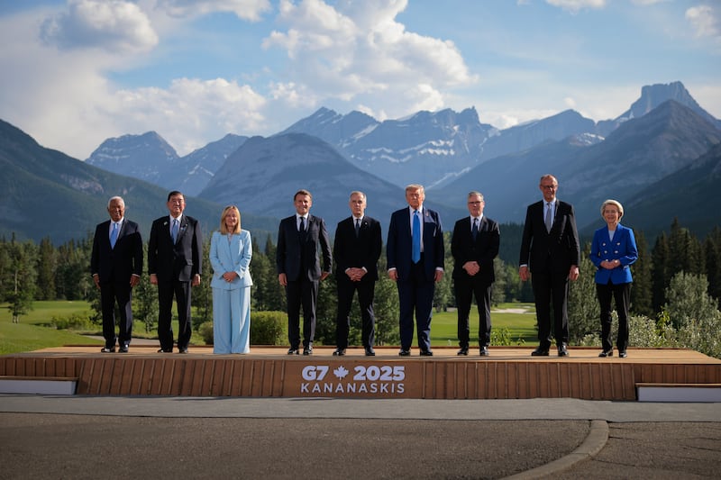 (L-R) European Union Council President Antonio Costa, Japanese Prime Minister Shigeru Ishiba, Italian Prime Minister Giorgia Meloni, French President Emmanuel Macron, Canadian Prime Minister Mark Carney, U.S. President Donald Trump, British Prime Minister Keir Starmer, German Chancellor Friedrich Merz and European Union Commission President Ursula von der Leyen pose for a group photo in front of the Canadian Rockies at the Kananaskis Country Golf Course during the G7 Leaders' Summit on June 16, 2025 in Kananaskis, Alberta. Canada