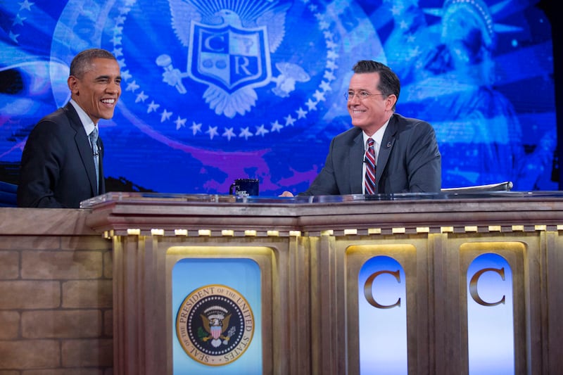 Barack Obama talks to television personality Stephen Colbert on December 8, 2014, in Washington, D.C.