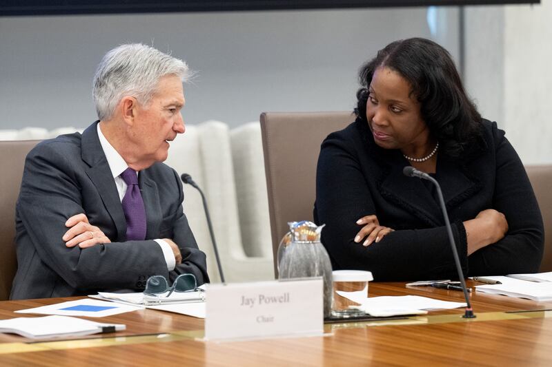 Chairman of the US Federal Reserve Jerome Powell speaks with Lisa Cook, member of the Board of Governors of the Federal Reserve, as he chairs a Federal Reserve Board open meeting.
