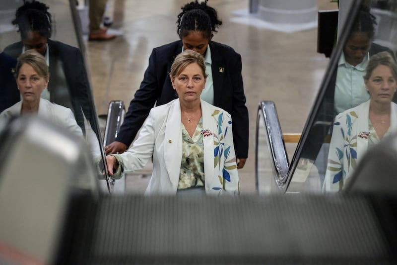 Darline Graham riding up an escalator