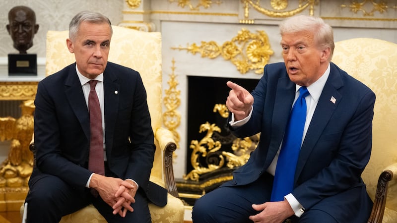 WASHINGTON,DC -   U.S. President Donald Trump met with Canadian Prime Minister Mark Carney in the Oval Office of the White House, Oct. 7, 2025, in Washington.(Photo by Sarah L. Voisin/The Washington Post via Getty Images)