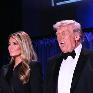 (L/R) White House Press Secretary Karoline Leavitt, US First Lady Melania Trump and US President Donald Trump attend the White House Correspondents' dinner at the Washington Hilton in Washington, DC, on April 25, 2026. President Trump is attending the annual gala of the political press for the first time while in office. (Photo by Mandel NGAN / AFP via Getty Images)