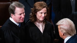 Supreme Court Justices Brett Kavanaugh and Amy Coney Barrett greet President Donald Trump after his address to a joint session of Congress in the House Chamber of the U.S. Capitol on Tuesday, March 4, 2025.