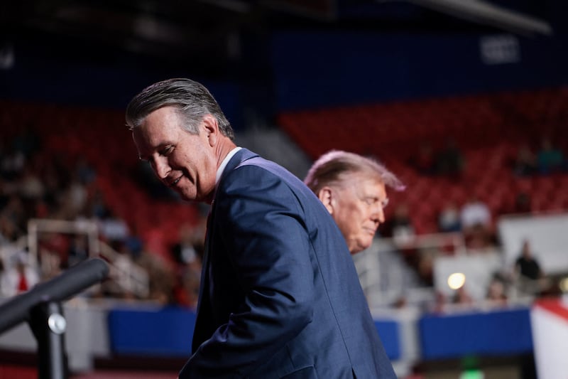 Republican Senate candidate Barry Moore on stage with President Donald Trump during Friday’s rally. Moore is running to replace Sen. Tommy Tuberville, who opted to run for governor instead of seeking re-election.