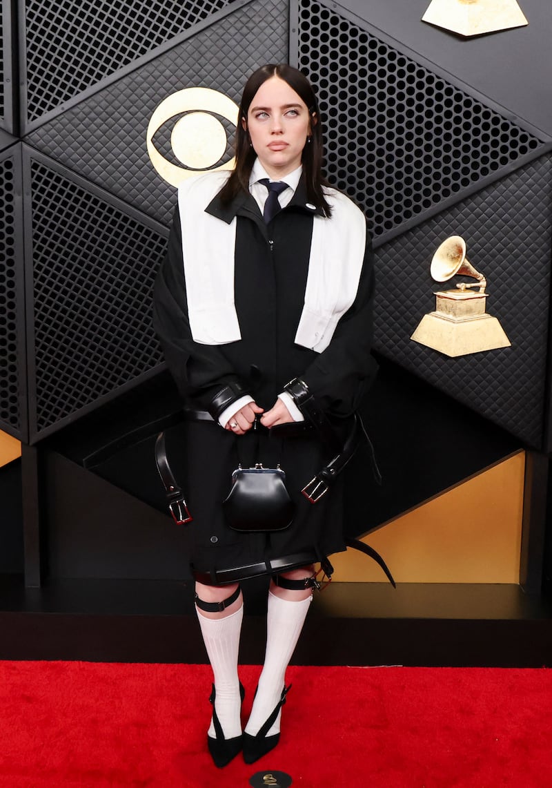 Billie Eilish wears an ICE Out pin as she poses on the red carpet during the 68th Annual Grammy Awards on February 1, 2026.