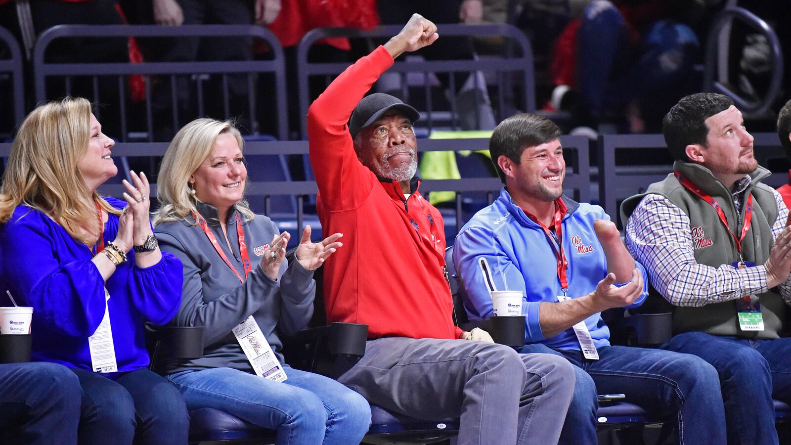 Actor Morgan Freeman (center) cheers on the Mississippi Rebels as they host the Auburn Tigers