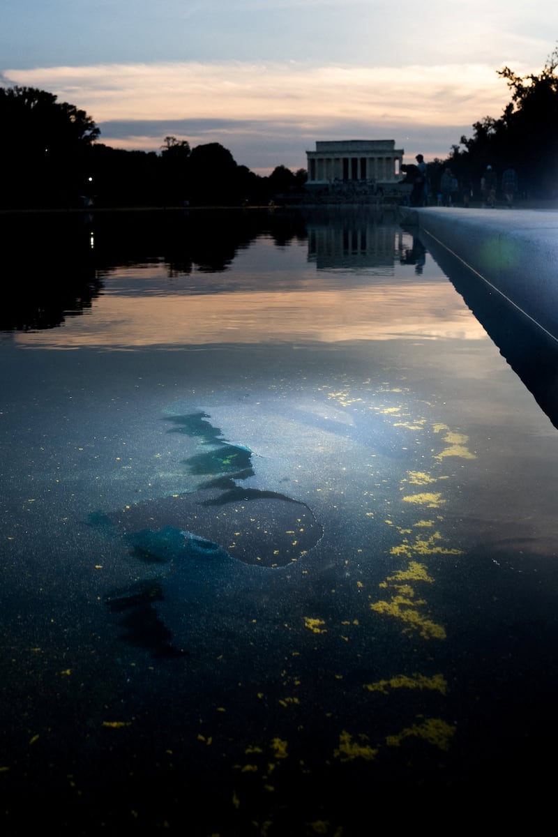 FILE PHOTO: Chipped paint and algae are visible in the Lincoln Memorial Reflecting Pool, after recent renovations following a directive from U.S. President Donald Trump to paint it blue ahead of the 250th anniversary of U.S. Independence, in Washington, D.C., U.S., June 21, 2026. REUTERS/Aaron Schwartz/File Photo